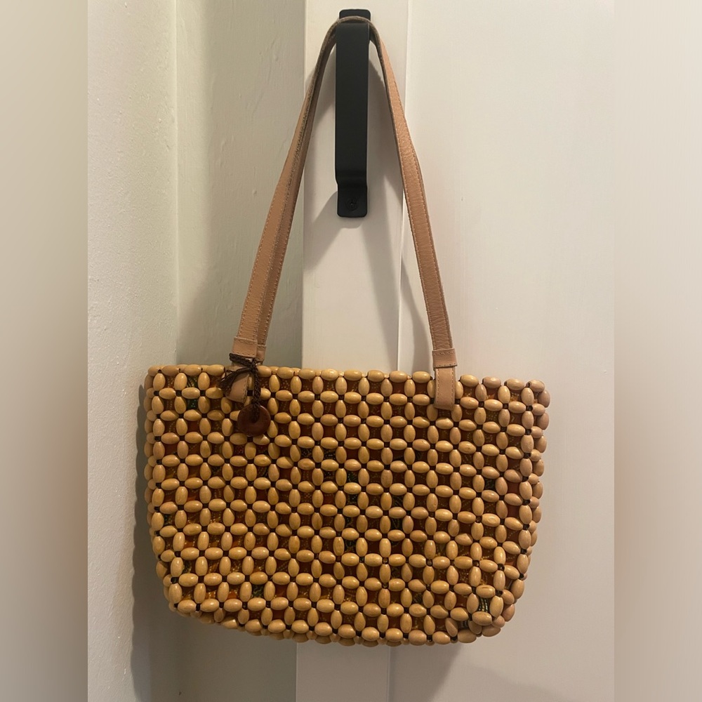 THE SAK WOODEN BEAD SHOULDER BAG  leather handles, fabric lining, leather trims.